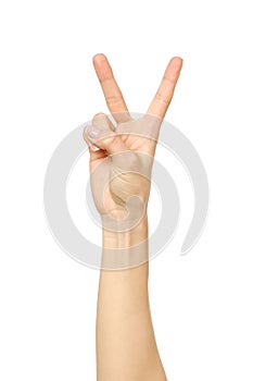 Woman`s hand with two fingers up in the peace or victory symbol