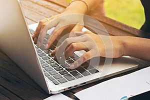 Woman`s Hand Typing on Laptop