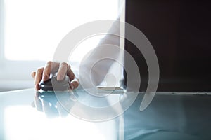 Woman's hand using cordless mouse