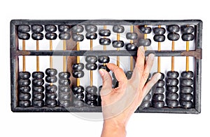 Woman's hands accounting with the abacus