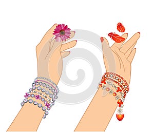 Woman`s hands with bracelets photo