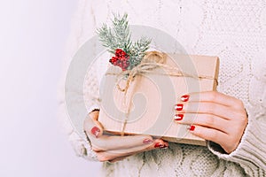 Woman`s hands with christmas gift box