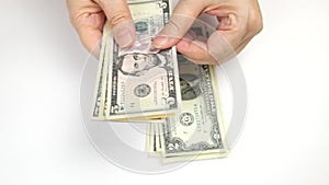 Woman`s hands are counting dollars close-up. 1, 2, 5, 10, 50 and 100 dollar bills