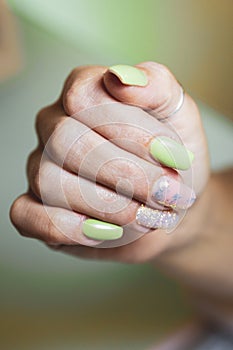 Woman`s hands with decorated nails