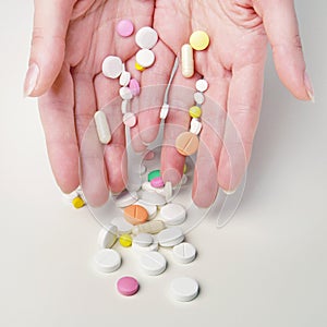 Woman's hands with different meds