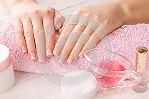 Woman`s hands with French manicure