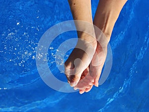 Woman's hands with fresh water