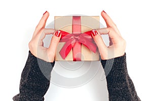 Woman`s hands with gift box