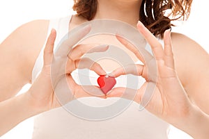 Woman's hands holding heart-shaped cookie photo