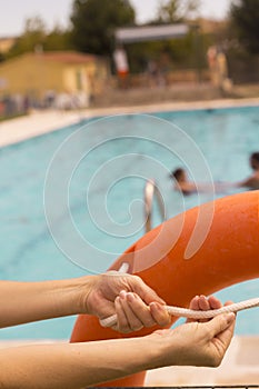 WomanÂ´s hands holding a lifesaver float