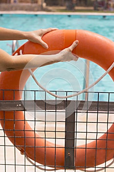 WomanÂ´s hands holding a lifesaver float