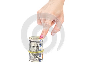 Woman`s hands holding rolled up dollar bills. Isolated on white