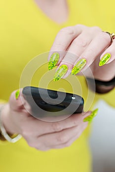 Woman\'s hands holding a smartphone