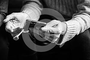 Woman`s hands holding a smartphone photo