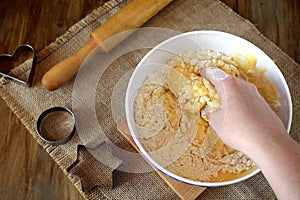 Woman`s hands are kneading shortbread dough