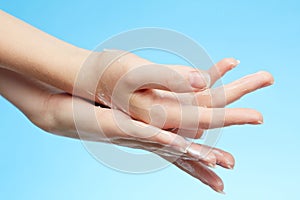 Woman's hands in moisturizer cream