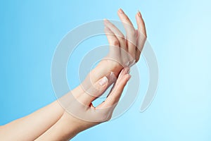 Woman's hands in moisturizer cream