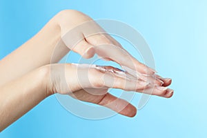 Woman's hands in moisturizer cream