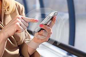 Woman`s hands with pda