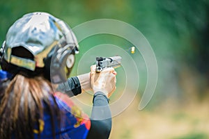 The woman`s hands are practicing firing guns and shelling out.