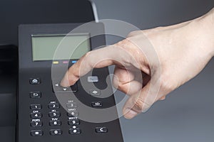 Woman`s hands pressing button on color laser printer