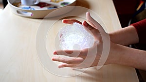 Woman's hands pressing hard on a bubble paper