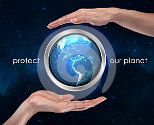 Woman`s hands protect planet earth