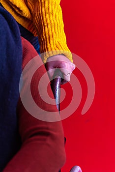 Woman`s hands pushing a wheelchair