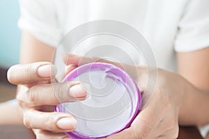 Woman`s hands test allergic whitening cream