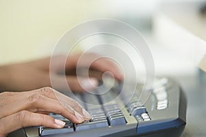 Woman's Hands Typing On A Computer Keyboard