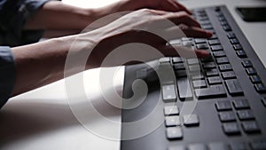 Woman`s hands are typing on a computer keyboard. Young business woman, freelancer working