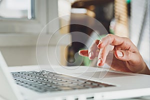 Woman's hands working on laptop computer