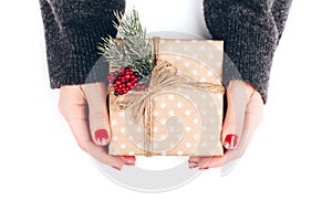 Woman`s hands wrapping Christmas gift box