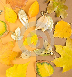 Woman`s Jewelry. Vintage jewelry autumn background. Beautiful gold brooches on yellow background. Flat lay, top view