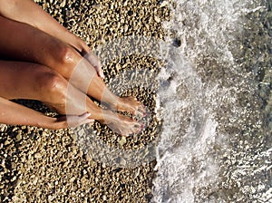 Woman's legs on beach