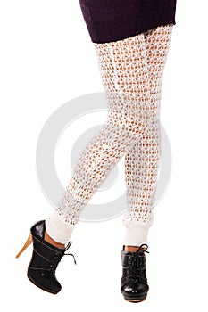 Woman's legs in a knitted leggings