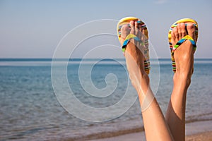 Woman`s legs and sea.