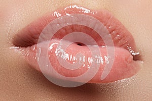 woman's lips. Beauty lips make-up. Beautiful make-up. Sensual open mouth. Lipstick and lip gloss. Natural full lips