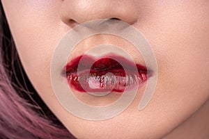 A woman`s lips with red lipstick