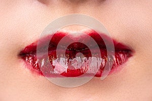 A woman`s lips with red lipstick