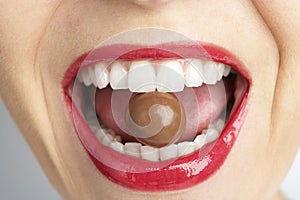 Woman's Mouth Biting On Chocolate