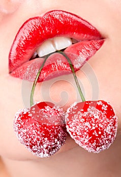 Woman's mouth with red cherries