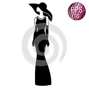 Woman`s silhouette in black hat and long dress