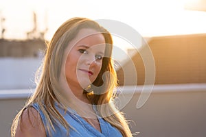 Woman with s smiling, looking at camera while feeling happy