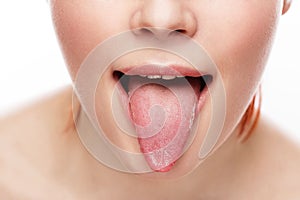 Woman's tongue. Woman with open mouth and pink toungue.