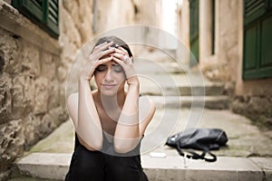 Woman with sad face crying.Sad expression,sad emotion,despair,sadness.Woman in emotional stress and pain.Woman sitting alone on th photo