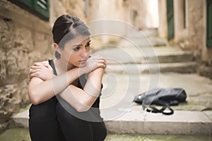 Woman with sad face crying. Sad expression, sad emotion, despair, sadness. Woman in emotional stress and pain. Woman sitting alone photo