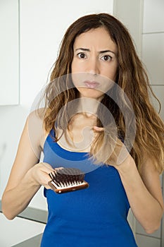 Woman sad because of losing hair