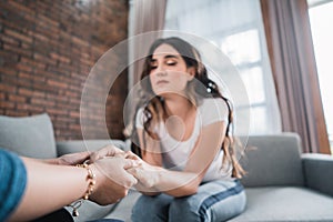 Woman with sad story sharing with friend photo