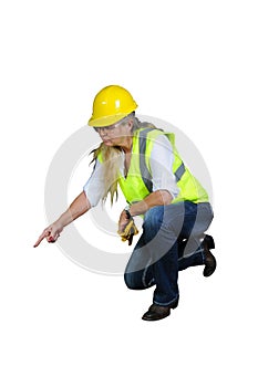 Woman in safety vest and hard hat working.